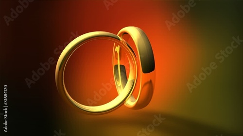 two gold wedding rings female and male