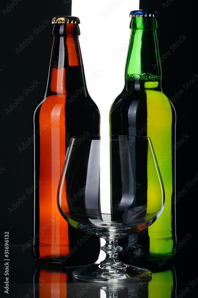 Bottles of beer from green and brown glass, isolated. Bottles of beer from green and brown glass, isolated.