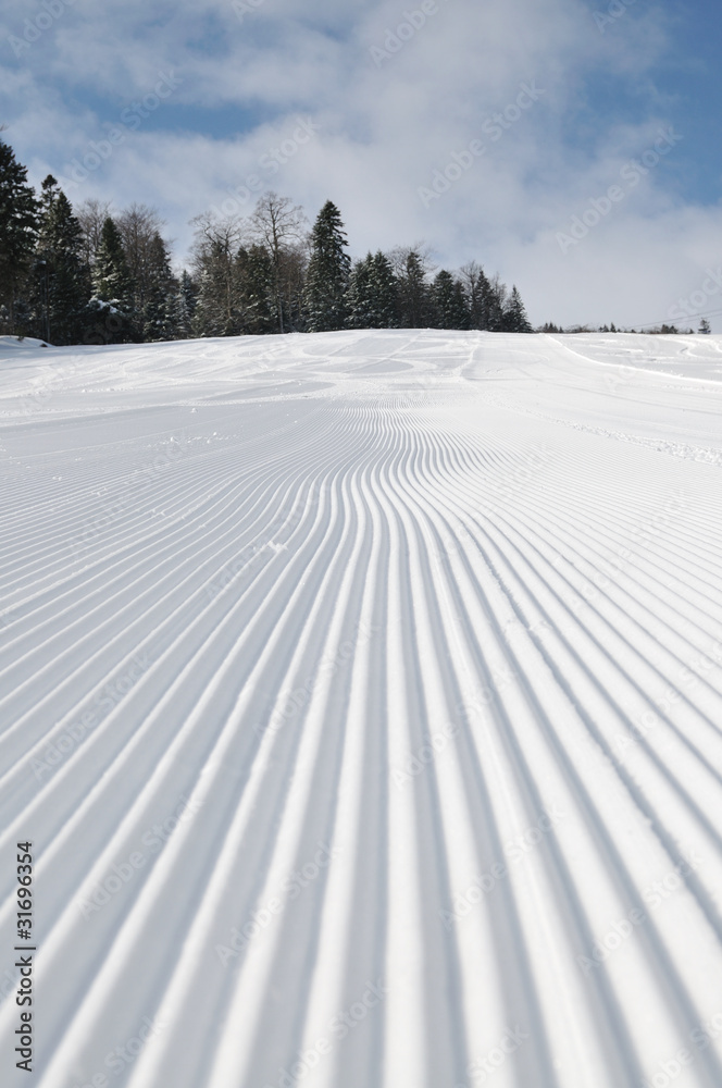 tracks on ski slopes at beautiful sunny winter day tracks on ski slopes at beautiful sunny winter day