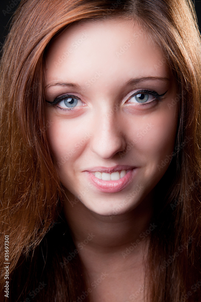 Close-up face of beautiful smiling girl. Studio shot Close-up face of beautiful smiling girl. Studio shot