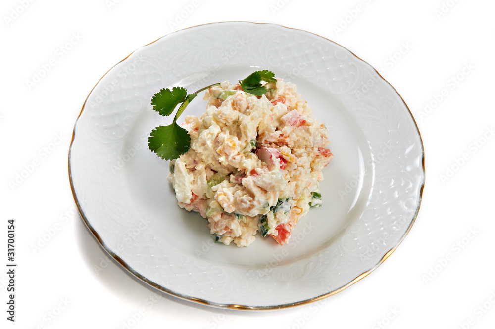 Crab salad of potatoes, crab sticks, corn, eggs and cucumber iso Crab salad of potatoes, crab sticks, corn, eggs and cucumber iso