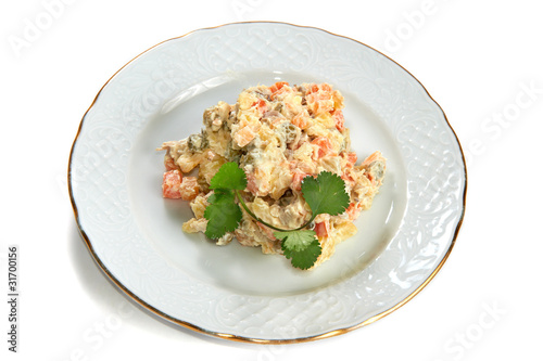 Olivier salad of potatoes, carrots, meat, peas, pickles, eggs is