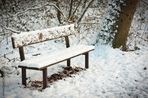 park bench snowed under