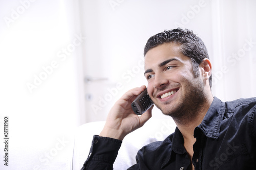 young man using telephone