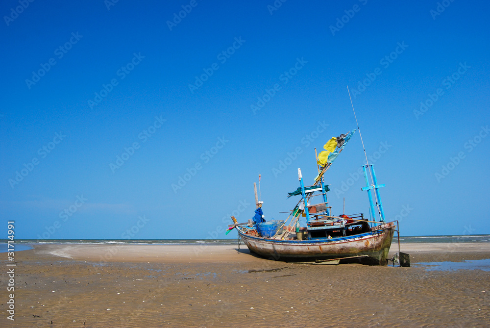 fisherman boat on the sea shore