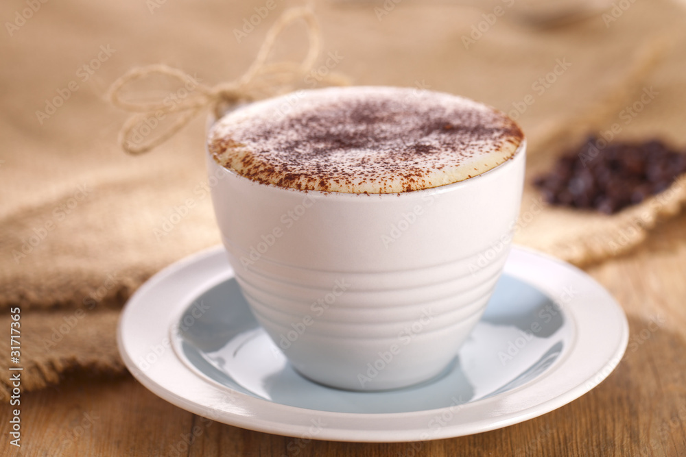Obraz premium hot frothy drink cappuccino coffee, rustic style, shallow dof