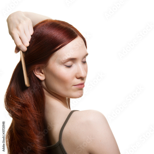 portrait of a beautiful young woman comb wonderful hair
