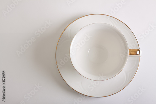 white empty cup and saucer top view
