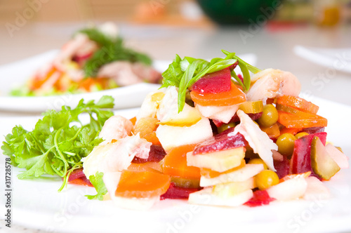 salad of beetroot, carrot, potato, green leek and fish