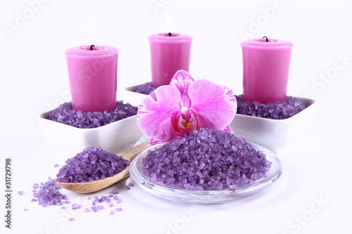 Lavender spa salt, candles and an orchid flower