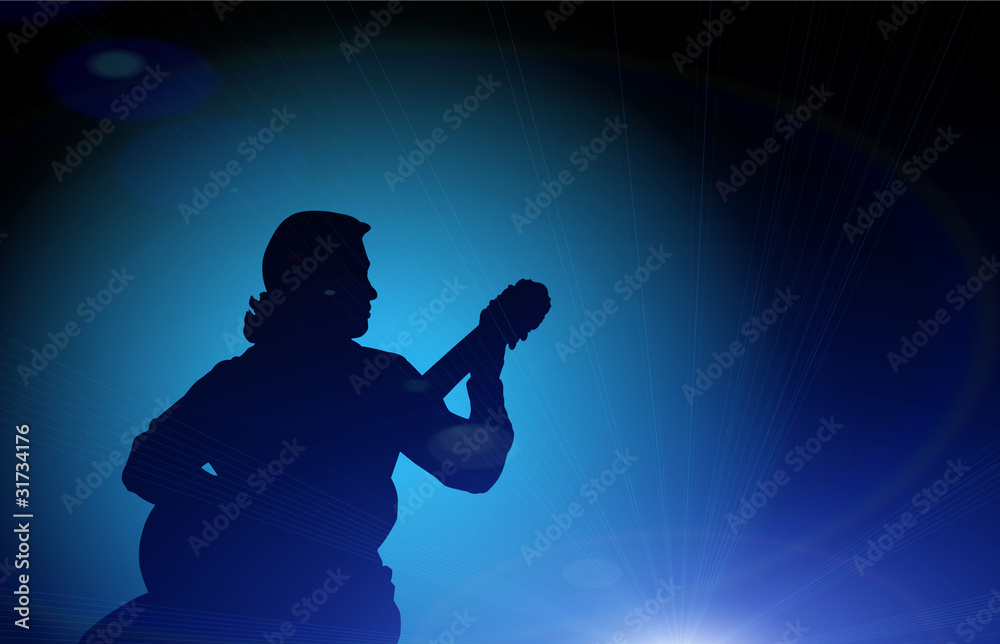 Guy playing the guitar - silhouette