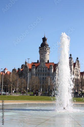 neues rathaus in leipzig mit springbrunnen photo