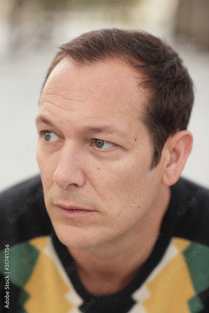 Fototapeta premium Man glancing away from the camera