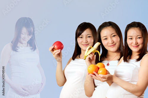 Pregnant Pretty Asian Girl with Fruit