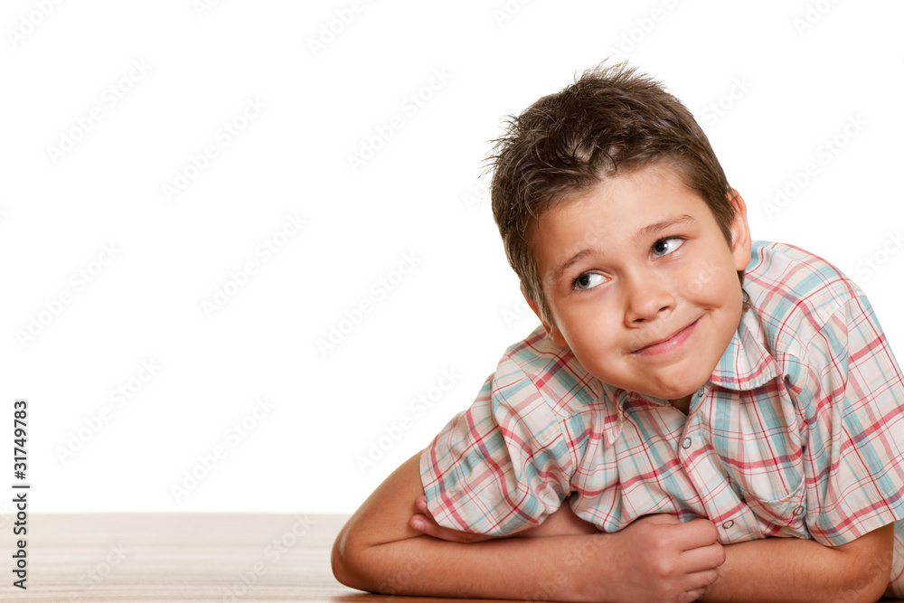 Cheerful boy lying on the floor Cheerful boy lying on the floor