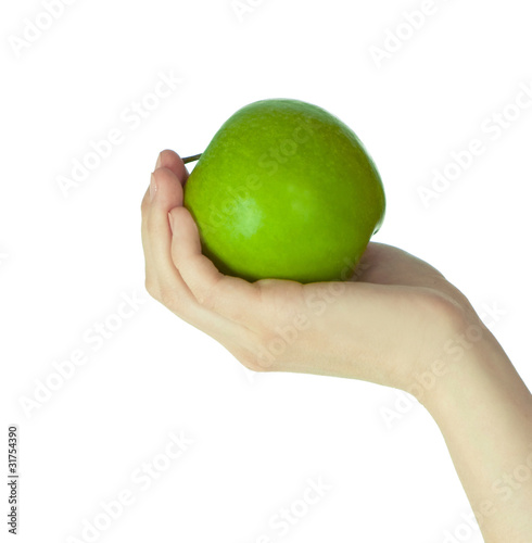 Green apple in the hand isolated on white background