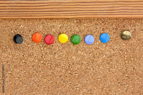 drawing pins in a cork pinboard