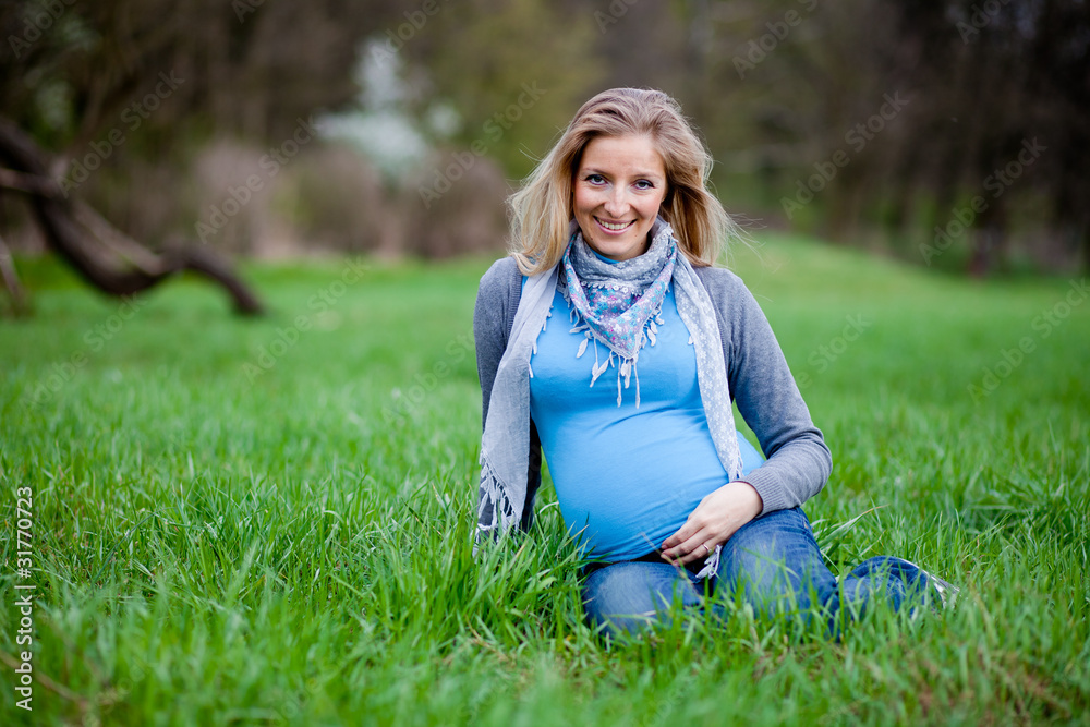 Fototapeta premium Pregnant woman outdoor spring time