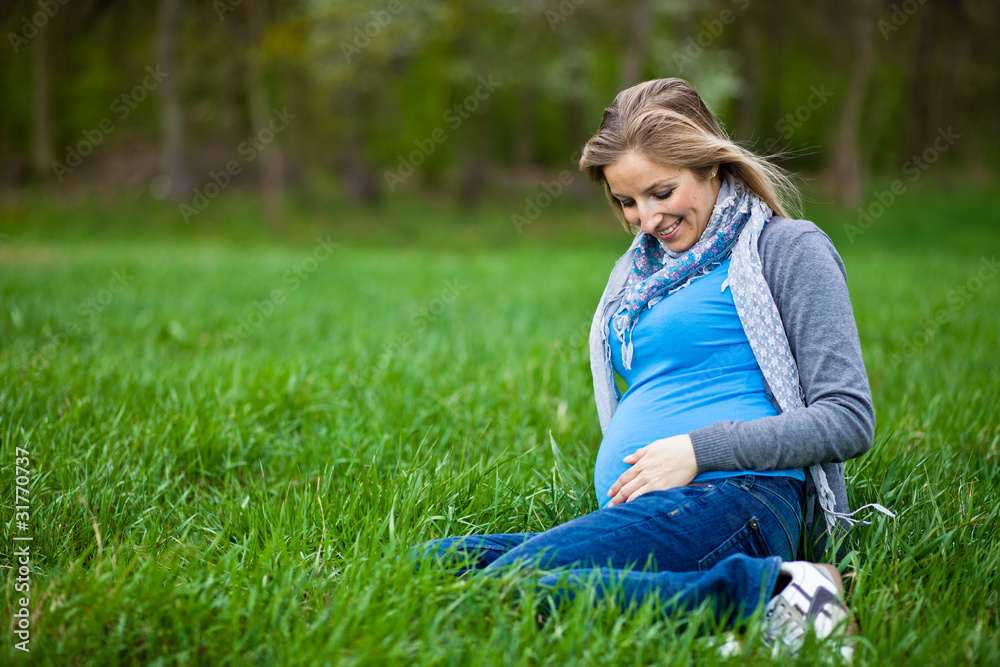 Pregnant woman outdoor spring time