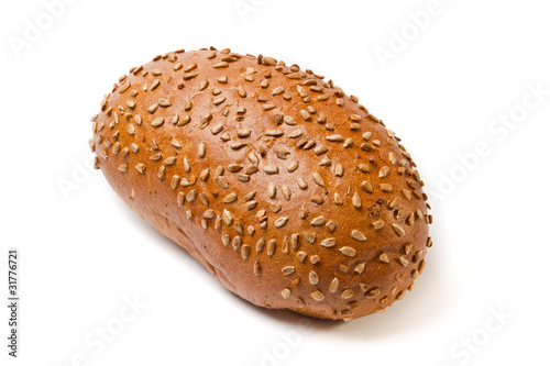 Dark brown coarse grinding bread loaf with sunflower seeds