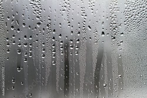 Water droplets on a glass surface photo