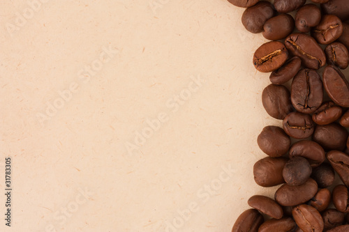 Coffee beans on old paper background © mbongo