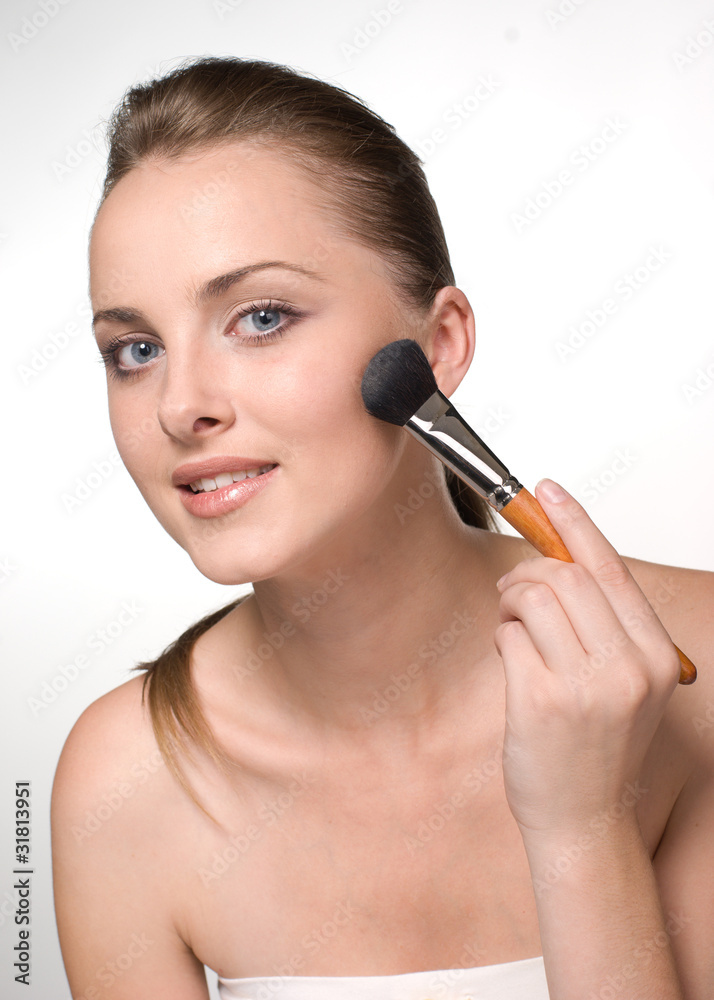 woman using a powder brush