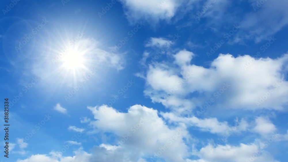 Time lapse cumulus clouds and the sun