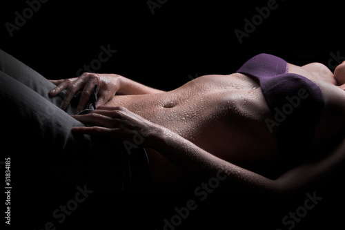 Foto de Sexy woman body, water drops on belly do Stock