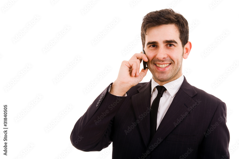 Smiling young business man on the phone, isolated on white Smiling young business man on the phone, isolated on white