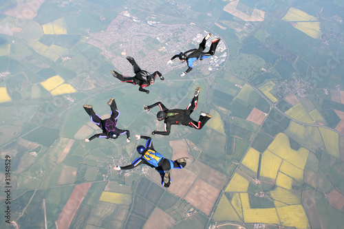 Five skydivers in freefall