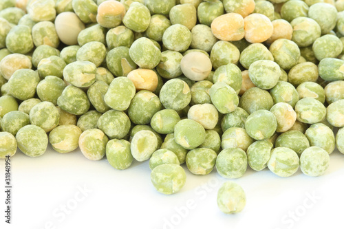 Dry green pea on white background photo