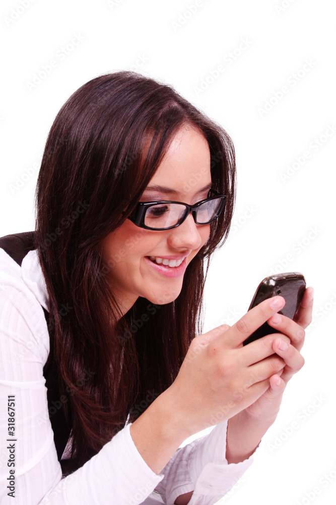 Beautiful happy woman sending text at mobile phone Beautiful happy woman sending text at mobile phone