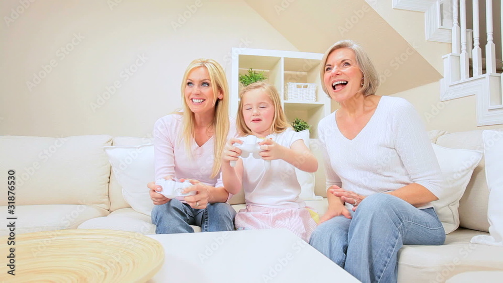 Three Generations of Females with Games Console Three Generations of Females with Games Console