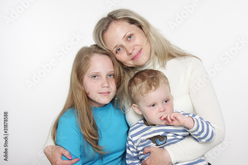 mother and two children over white