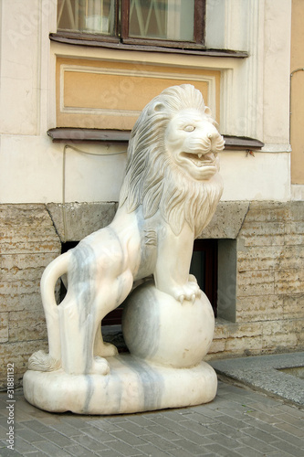 The marble figure of a lion on the streets of St. Petersburg photo