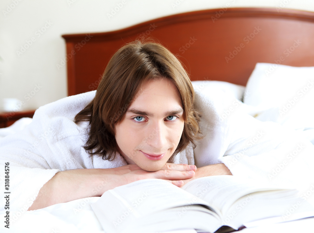 portrait of a young man in bed portrait of a young man in bed