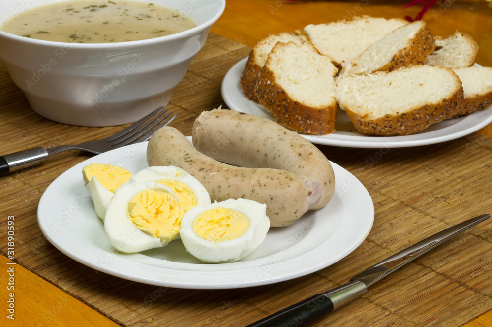 Eggs and white sausages for Easter breakfast Eggs and white sausages for Easter breakfast