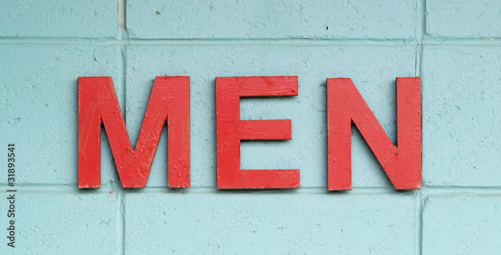 MEN in red against an aqua blue painted wall MEN in red against an aqua blue painted wall