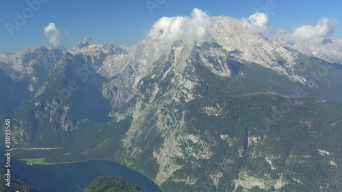 Time lapse clouds Mt. Watzmann. Ships on Koenigssee.
