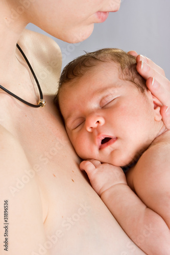 picture of  mother with slepping baby over white photo