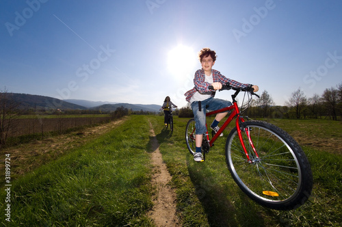 Girl and boy riding bike