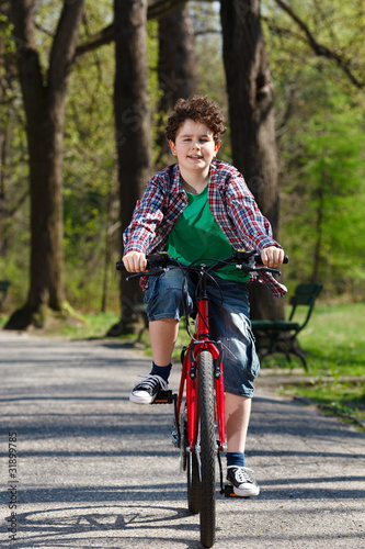 Fototapeta Naklejka Na Ścianę i Meble -  Boy riding bike