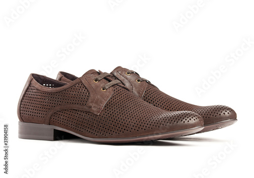 Pair of brown male shoes on the white background
