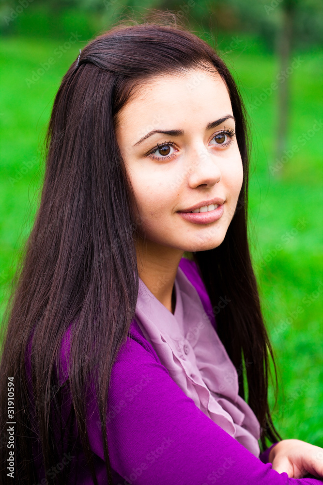 Fototapeta premium portrait of a beautiful young woman outdoor