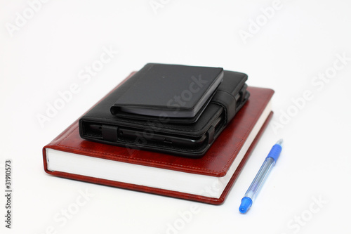 Calculator,book and pen on white background