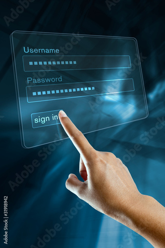 a woman hand sign in her login and password on a screen