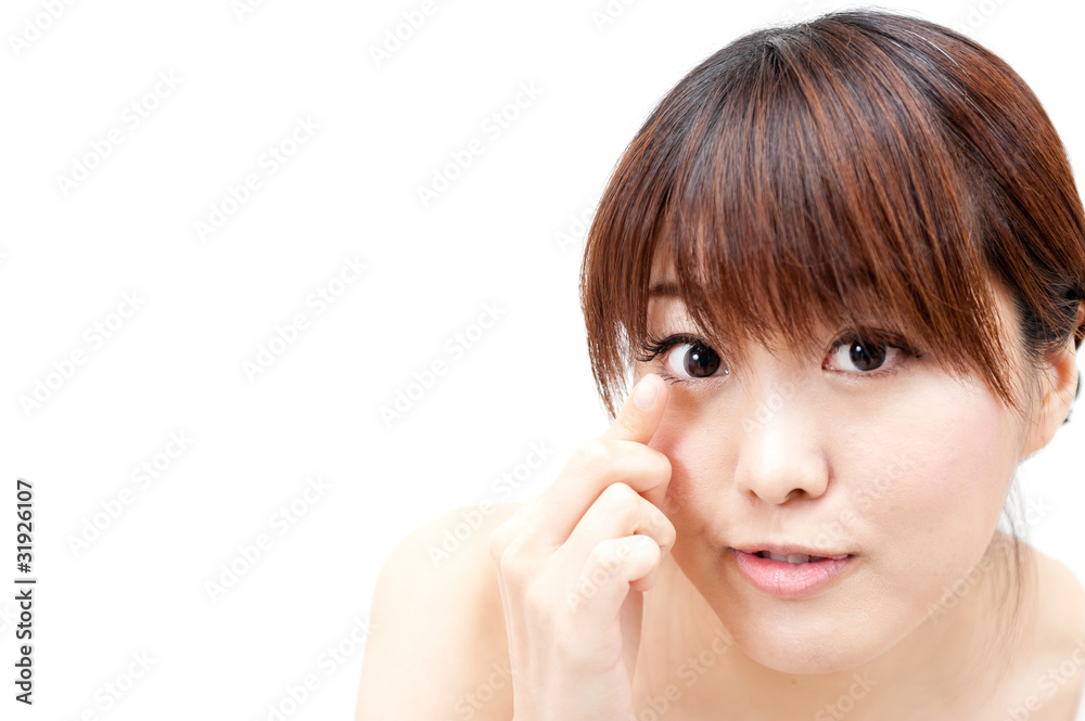 beautiful asian woman taking care of her eye beautiful asian woman taking care of her eye
