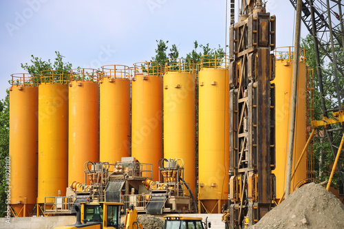 yellow silos in industrial site