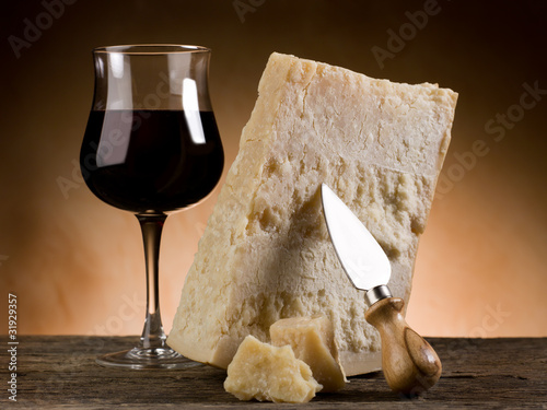 parmesan cheese and glass of red wine